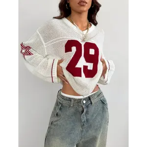 A Oversized Knitted Sweater with Striped And Number Prints, Featuring Long Sleeves.