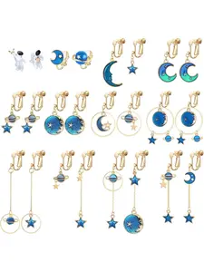 12 Pairs Golden Blue Clip on Earrings Set for Women Men Aesthetic Blue Star Moon Planet Saturn Designs Premium Alloy Into Stylish Non Pierced Dangle Earrings Assorted Ear Clip Collection Weird Trendy Celestial Motifs of Star Moon Saturn Planet Shapes