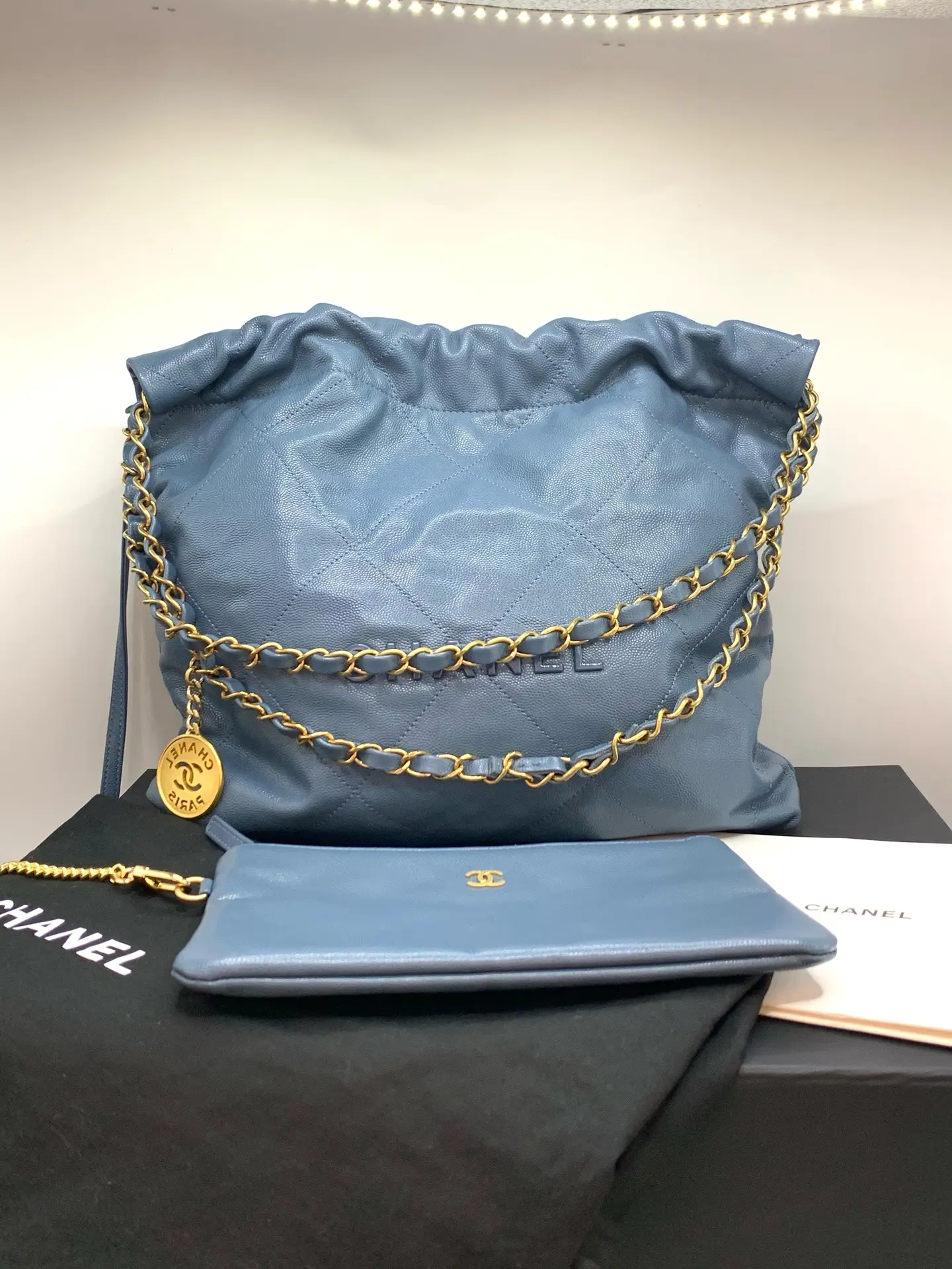 Pre-owned CHANEL 22 Bag in Blue Quilted Caviar Leather, Chain Shoulder Bag. Comes with Box, Dust Bag, Booklet, and Pouch. Bottom Length: 30 cm.