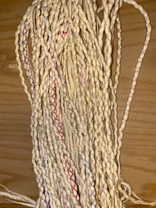 Light blonde wool dreadlock extensions, braids, merino wool.