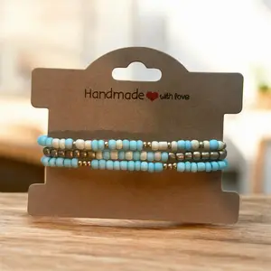 Light turquoise/cream with gold accents stackable bracelet set