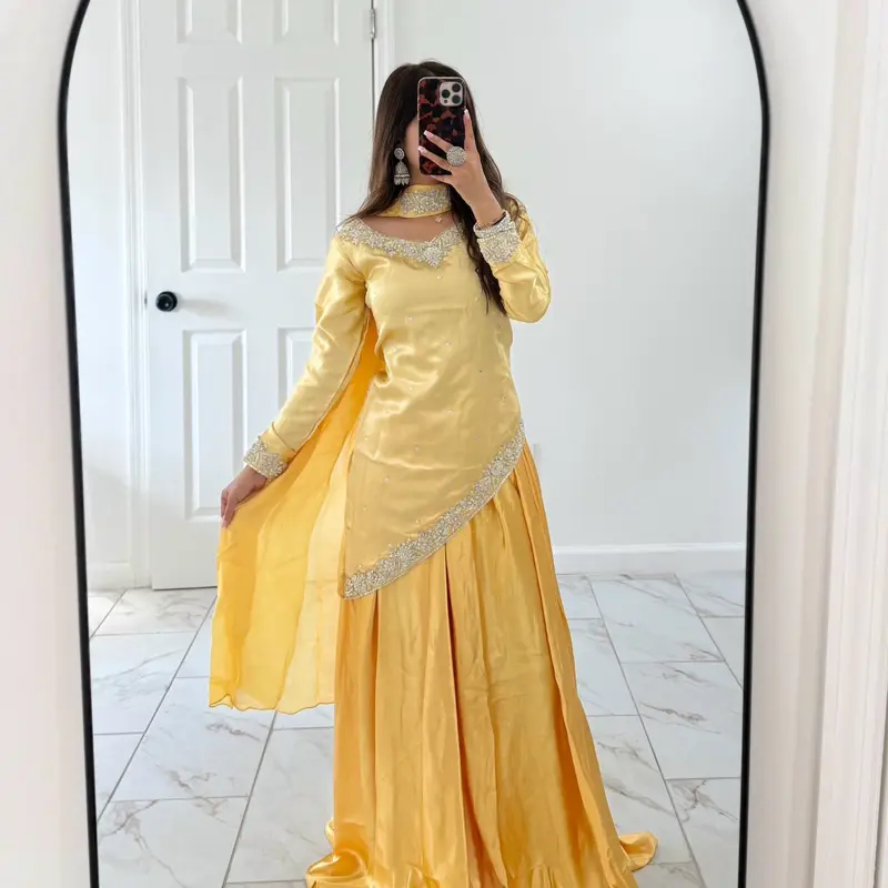 Women’s Butter yellow Pakistani wedding sharara with choker dupatta and corset waist tie with silver handwork