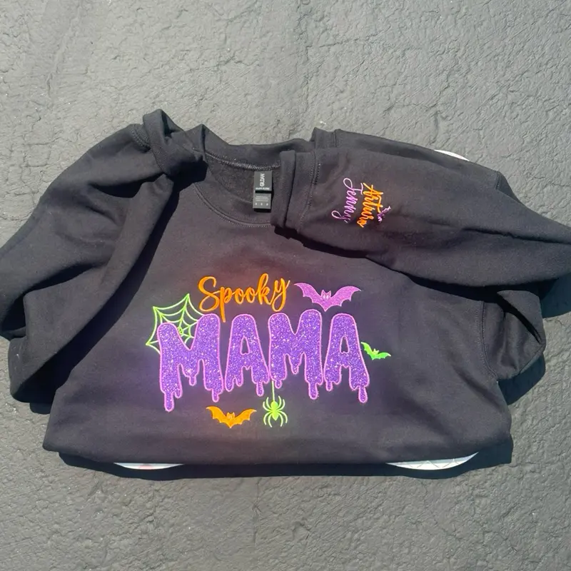 Spooky Mama Black Sweater With Glitter HTV and Personalized Sleeve Soft Womenswear Cotton Polyester Blend Embroidered Design Custom Appliqué Everyday Wear