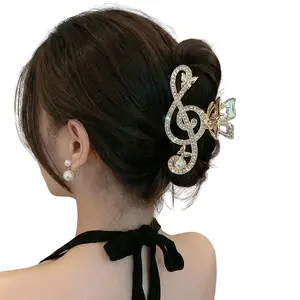 Treble Clef Hair Clip Gold Color Sparkling Rhinestone Barrette with Butterfly Accents for Music Lovers Formal Events and All Day Glam Musical Charm Hairpins