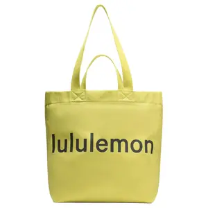 Lululemon Double-Handle 17L Tote Bag with Brand Logo in Cotton for Men and Women in Serpentine Yellow and Slate Brown