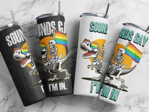 "Sounds Gay Im In" Tumbler  with a skeleton on a dino and rainbow flag with choice of white or black background
