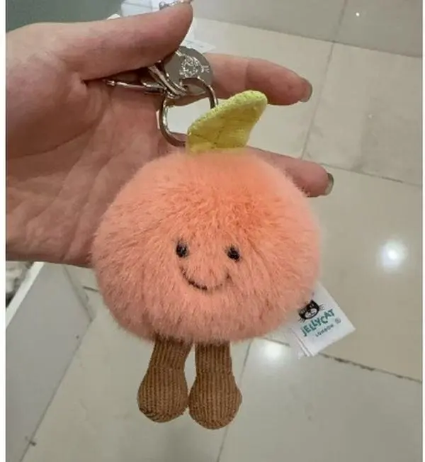 Jellycat Amuseables Peach Bag Charm – Cute Plush Peach Keychain, Soft Kawaii Backpack Charm, Collectible Bag Accessory, Gift for Kids, Teens & Jellycat Fans