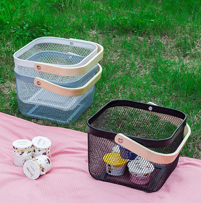 Multi-color metal mesh storage baskets with smooth wooden carry handles, breathable hollow design holds snacks, cosmetics and daily sundries, ideal for home storage, outdoor picnic trips and neat closet organizing projects