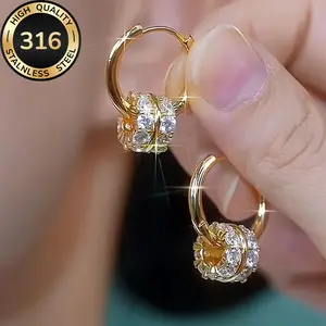 A pair of luxurious hoop earrings made of hypoallergenic 316 stainless steel with synthetic zirconia stones, featuring a minimalist design, a jewelry gift for women.