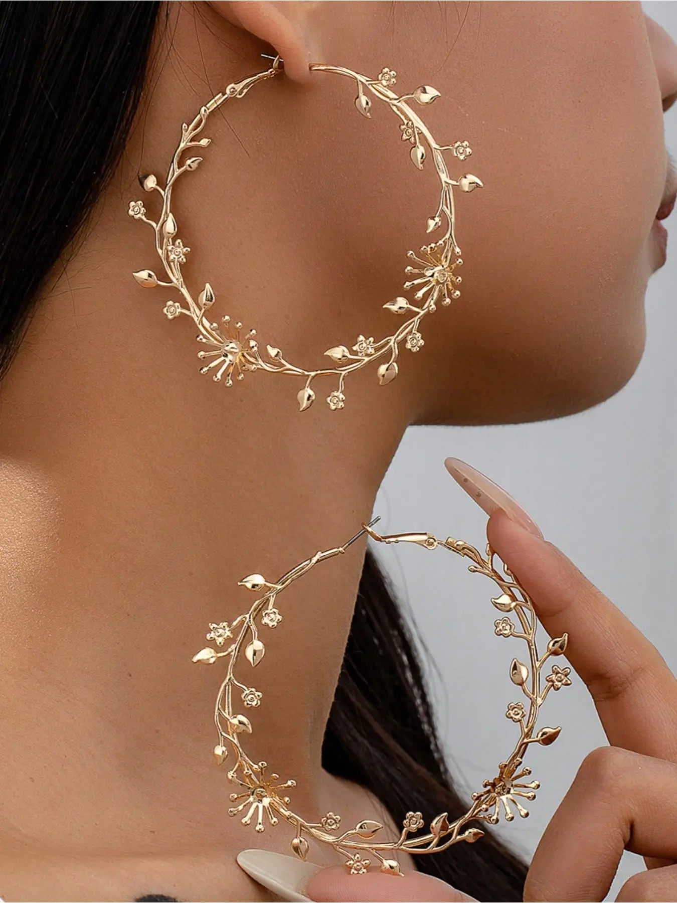 A pair of oversized earrings with exaggerated golden floral designs – sweet, stylish, and absolutely gorgeous earrings. Flower Earrings