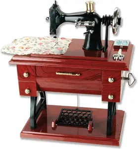 Vintage Mini Sewing Machine Music Box – Crank it and listen to a tiny melody. Retro plastic tabletop decor that doubles as a toy gift for kids. Brown finish, nostalgia included. Whimsical, charming, and screen‑free fun for little hands.