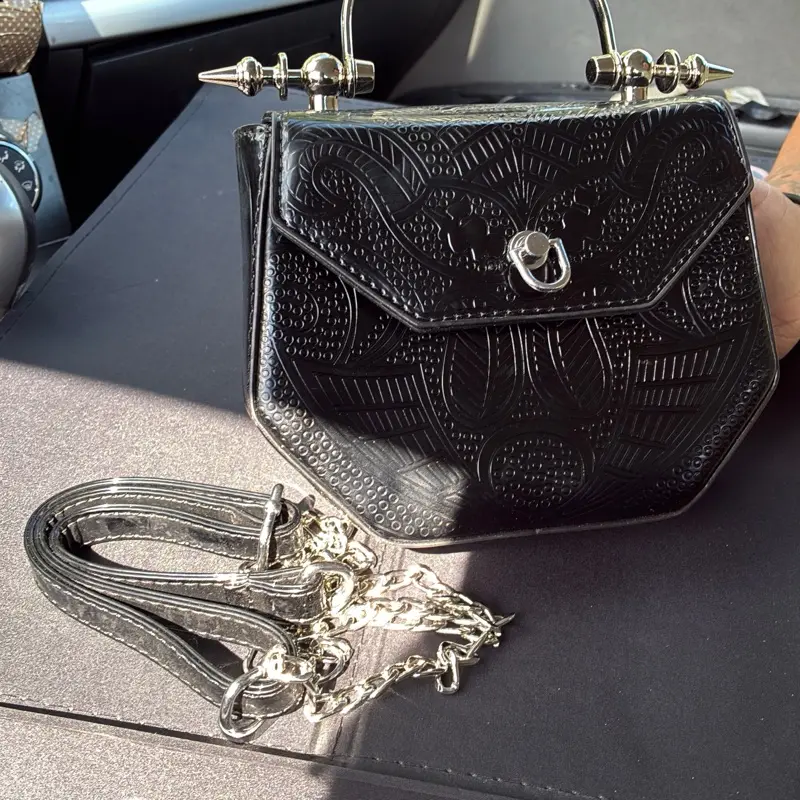 Women’s Unique Black Embossed Handbag with Silver Hardware and Unique Design Comes With Chain