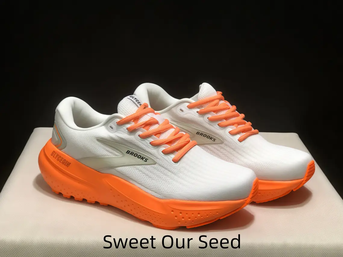 Durable breathable white mesh performance running shoe with striking orange sole, versatile design for trail runs, hiking, gym sessions and everyday sport casual wear.