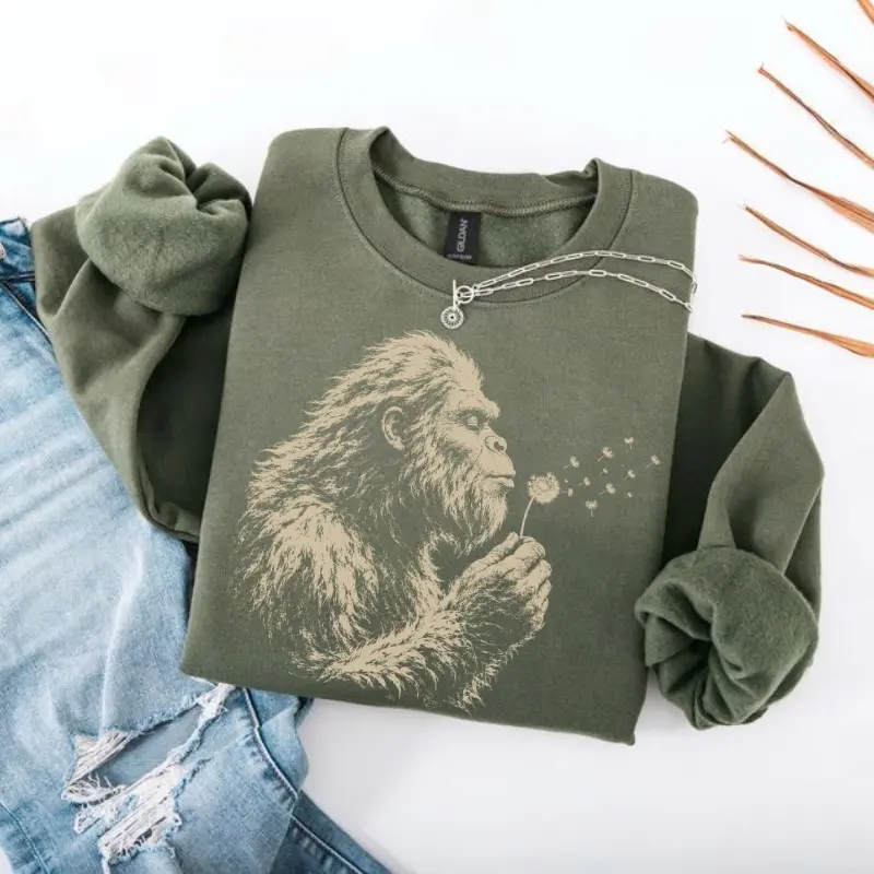 Bigfoot Dandelion Sweatshirt, Vintage Sasquatch Nature Sweater, Woodland Cryptid Graphic Sweatshirt, Outdoor Adventure Shirt, Bigfoot Lover Gift