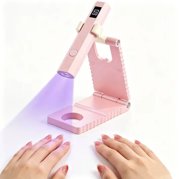 2026 Portable UV Nail Lamp with Foldable Stand – 360° adjustable, pink flash cure lamp perfect for gel polish. Designed to relax your hands during DIY manis, it’s the ultimate home salon tool for effortless, salon-quality nails