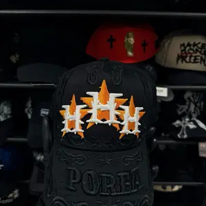 PORFA Unisex Black Baseball Cap with Orange-and-White Embroidered Logo