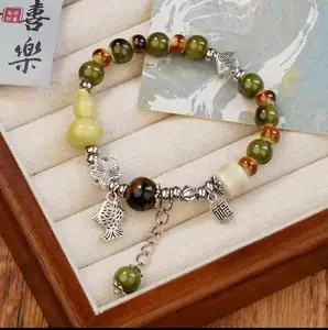 Blue glaze ceramic bracelet featuring good fortune and carp bringing blessings