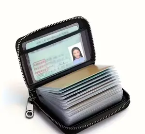Zipper closure, multiple card slots, black exterior, unisex design, secure card storage, stylish and durable wallet, compact travel design, perfect for frequent travelers.