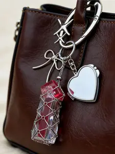 Silver lipstick mesh bag, metallic lipstick storage bag charm. Features replaceable stainless steel mesh bag, bow-adorned lipstick case keychain, **with a heart-shaped mirror**. Designed with mango star button and bamboo knot mesh bag.