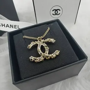 Pre-owned Chanel Gold Brass Bicolor Strass Crystal Mark Necklace 1108GIA0038