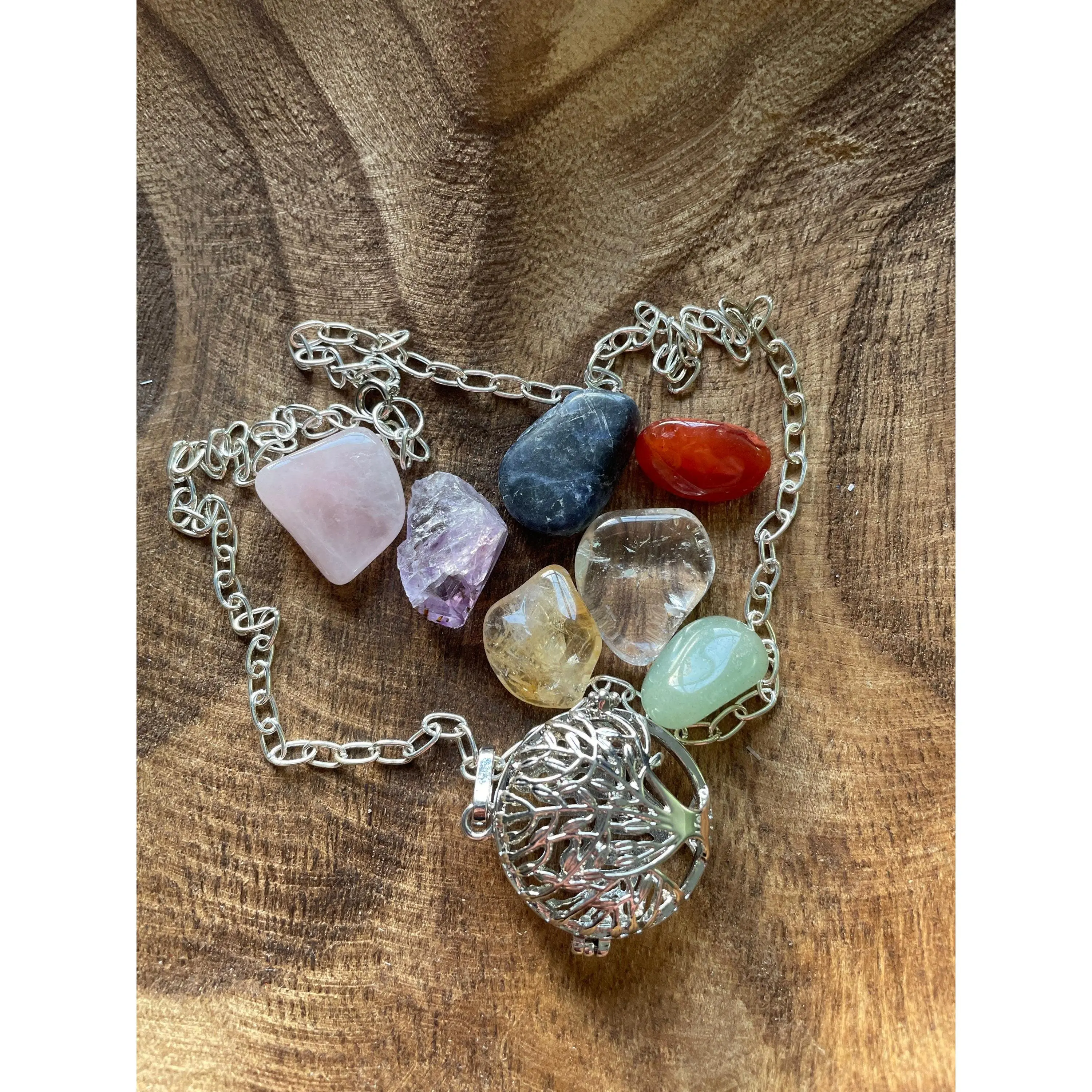 Silver round Tree of Life locket with 7 interchangeable crystals on 16+ inch silver plated chain