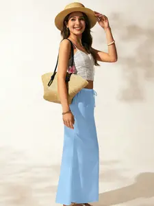 A women's light blue linen-textured high-waist drawstring straight long skirt, Breathable skirt, with a fresh and relaxed style, suitable for casual settings that prioritize comfort, such as seaside vacations, city strolls
