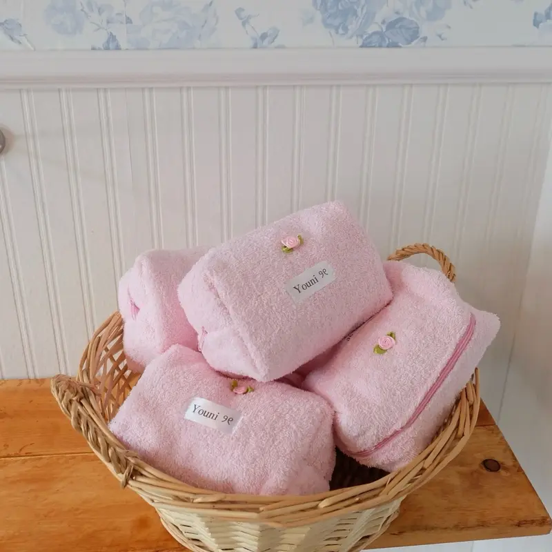 Pink terry makeup pouch with bow charm Pink terry makeup pouch with bow charm