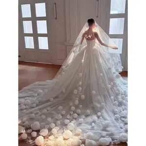 Luxury-style long veil with dreamy, elaborate floral designs and a cathedral-style train