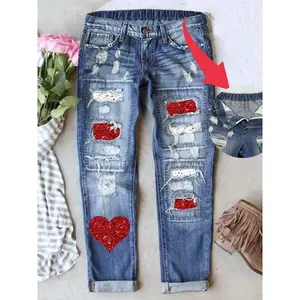 Women’s boyfriend jeans with a distressed patch design, featuring multiple cute prints; loose mid-rise stretch denim that is both comfortable and well-fitting year-round. GARMENTARY