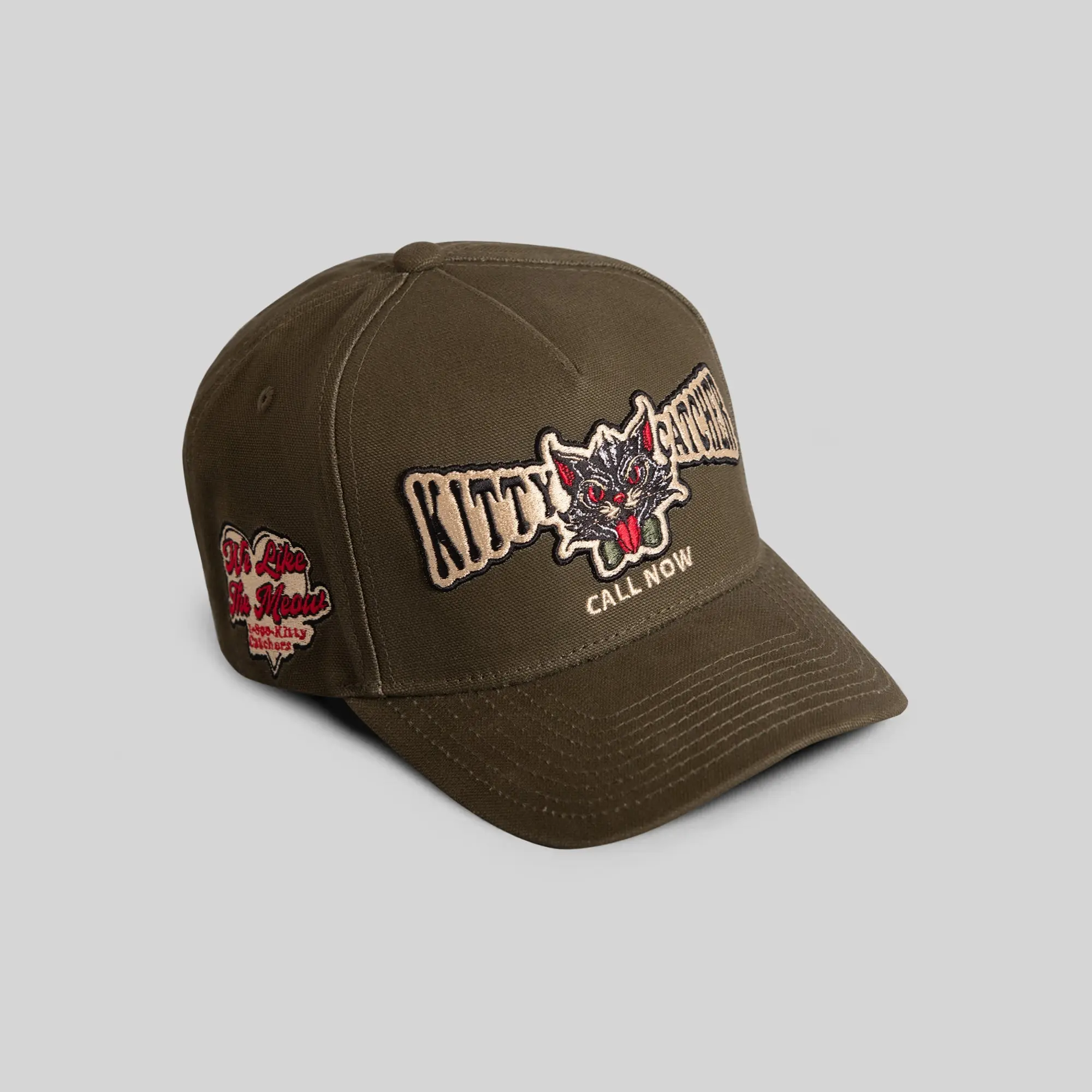 Field Grade Kitty Catcher Olive Duck Canvas | trucker hat | duck canvas | olive green | embroidered | adjustable | mesh back | unisex | casual | streetwear | dad hat | vintage | outdoor | Trendy Hat 2026 | Streetwear Headwear | Fashion Cap | Summer Hat