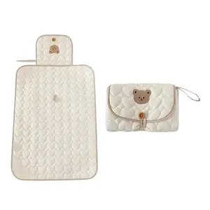 Cream Bear-Patterned Portable Diaper Changing Pad, Foldable and Breathable Polyester with Adjustable Strap for Travel, Secure Closure and Diaper Pouch