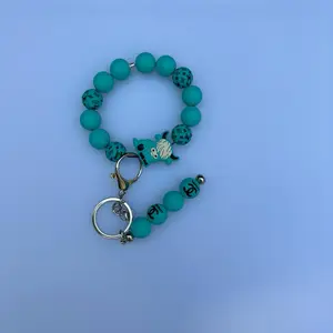 LV Cow Keychain - Turquoise Beaded Design with Unique Charm and Key Ring Attachment