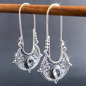 A pair of bohemian vintage earrings, carved and hollow long earrings, earrings made of alloy with synthetic gemstones, ethnic-style vacation earrings, travel jewelry.