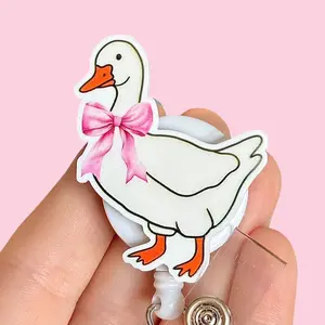 Glitter My Badge Pink bow silly coquette goose all my systems are nervous badge reel for nurse and hospital workers. Badge clip Badge pull - Retractable swivel clip with a 360 rotation. Great gift for coworker.