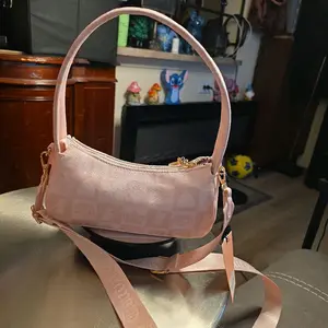 Juicy Couture (new w/tags Geniune)  Elegant Pink Crossbody Bag with Gold Accents and Adjustable Strap for Everyday Use