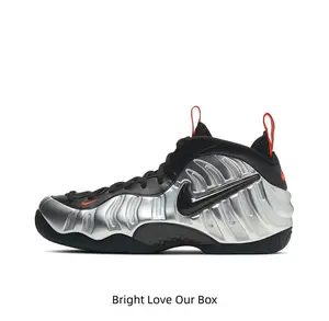 Mirror silver ripple molded mid tops with full black base, thin orange pull tabs add striking contrast for futuristic techwear outfits