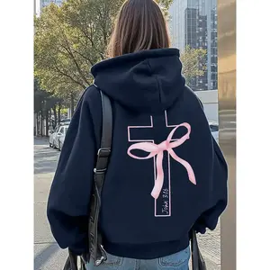Women’s fitted hoodie with a pink bow cross design and “John 3:16” print—faith-based streetwear for casual fashion and religious apparel