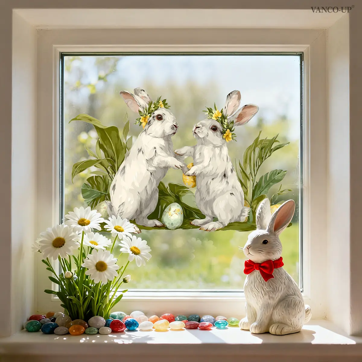 A (30*45cm) Easter window sticker featuring a rabbit wearing a yellow flower wreath, Easter eggs and leaves. It is a static cling glass sticker for decorating holiday homes, windows and shop windows. D21451