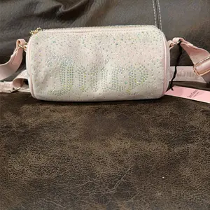 Juicy Couture Pink Rhinestone Crossbody Bag with Adjustable Strap and Zipper Closure