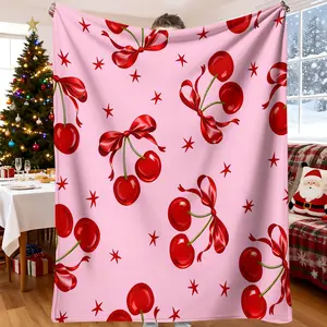 This pink cherry and bow print blanket is a comfortable, soft, and lightweight blanket suitable for all seasons, making it a great gift.