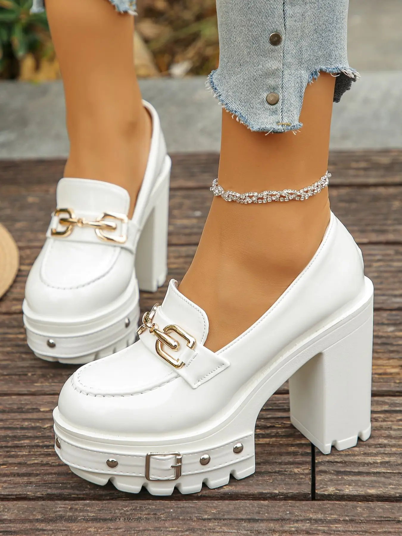 A pair of Women's Platform Block Heel Loafers, Patent Leather Upper, Chunky Studded Lug Sole, Gold Chain Buckle Accent, Edgy Platform Shoes, High Heel Loafers for Parties, Fashionable Party Shoes, Slip-On Design, Trendy Heeled Loafers