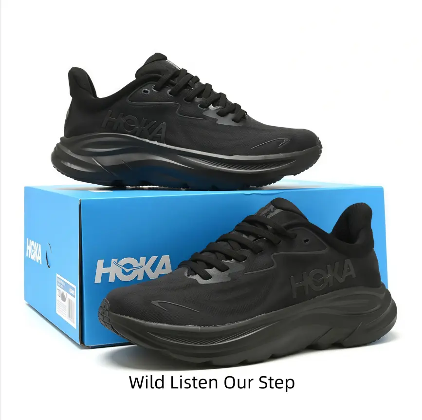 Cushioned running sneakers, full black breathable engineered mesh upper, tonal matte branding, streamlined wavy thick midsole, sleek monochrome design for workouts, jogging and everyday street outfits.