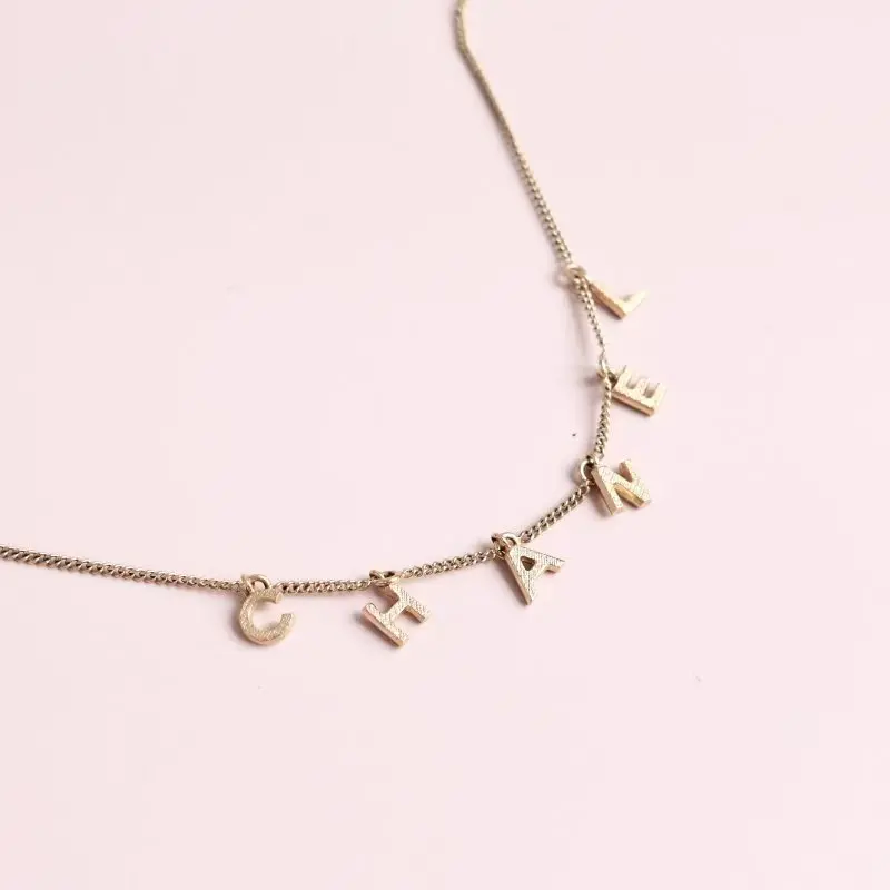 Pre-owned Chanel Dainty Dangling Deconstructed Logo Textured Gold Short Necklace 0513GIA