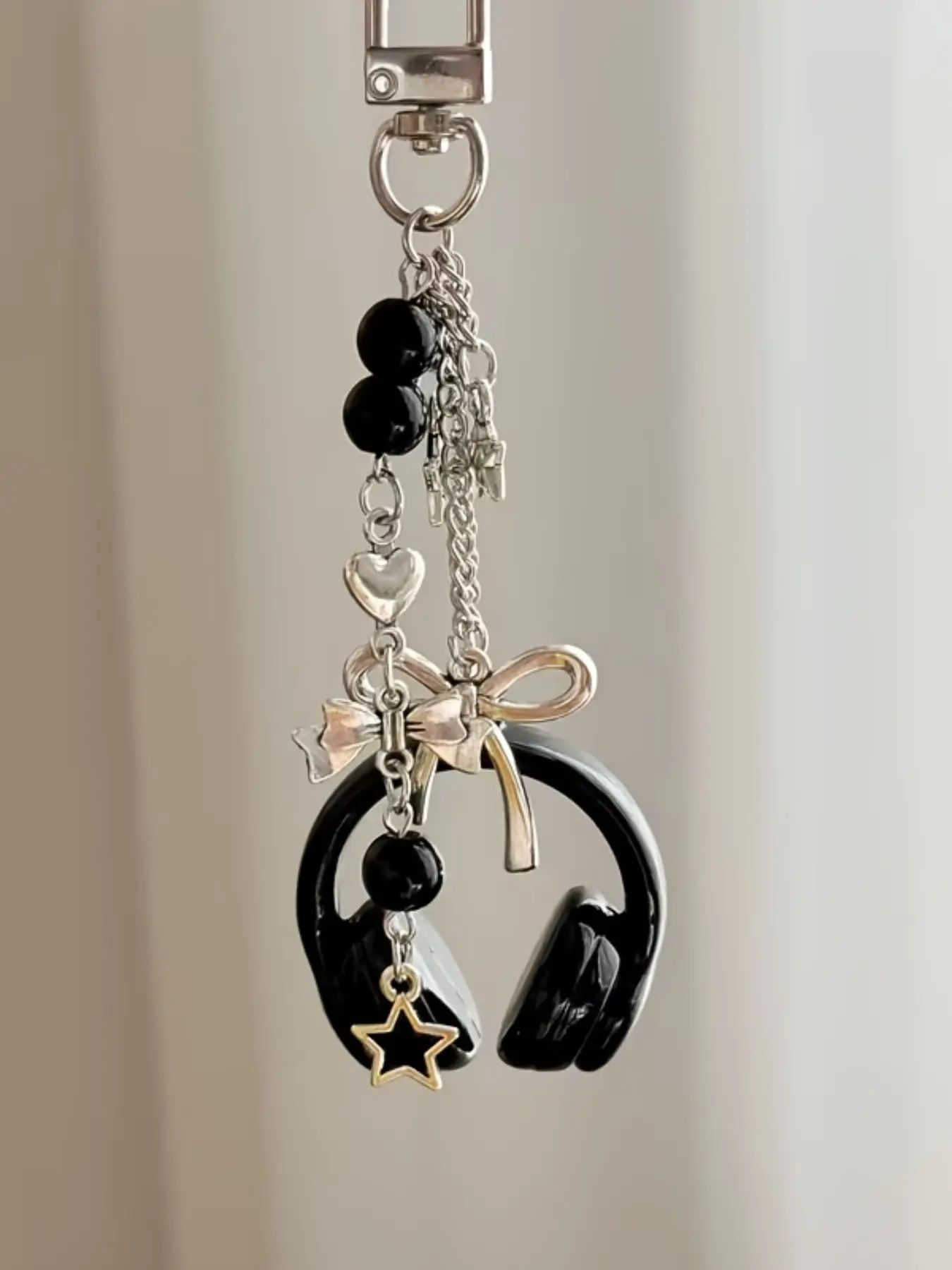 Y2K music vibes unlocked This headphone bag charm blends Coquette sweetness with gothic edge, perfect for spring OOTDs and bold gifting. Sparkly Bag Charm Keychain, Bag Accessories #Y2KStyle #CoquetteAesthetic #HeadphoneCharm #SpringAccessory #GiftForHer