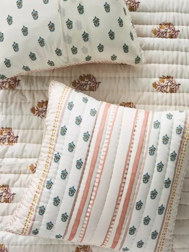Decorative pillows are made from printed cotton fabric, which is soft, breathable, and suitable for bedrooms.