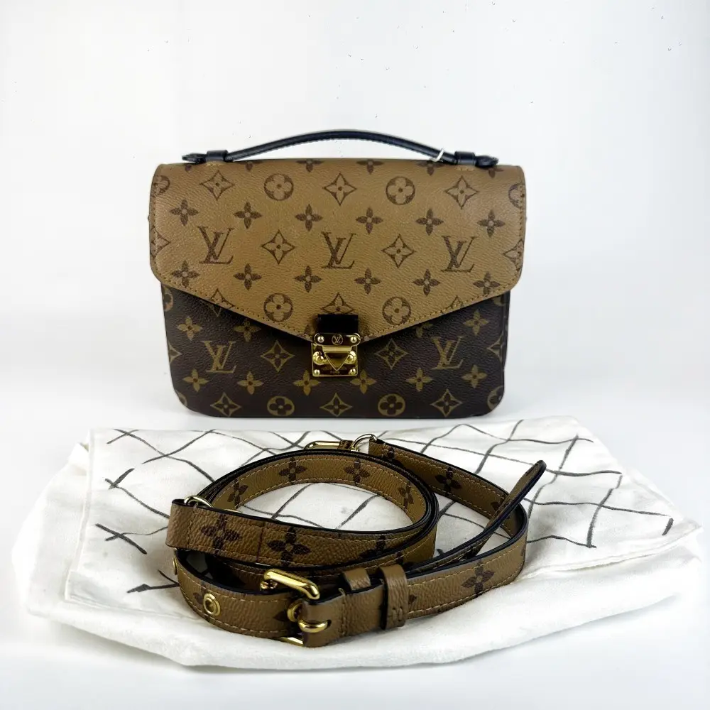 Pre-owned Louis Vuitton 737 Pochette Métis Reverse Monogram Canvas Top Handle Bag