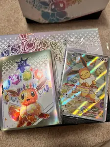 Pokemon Prismatic Evolutions eevee promo and sleeves