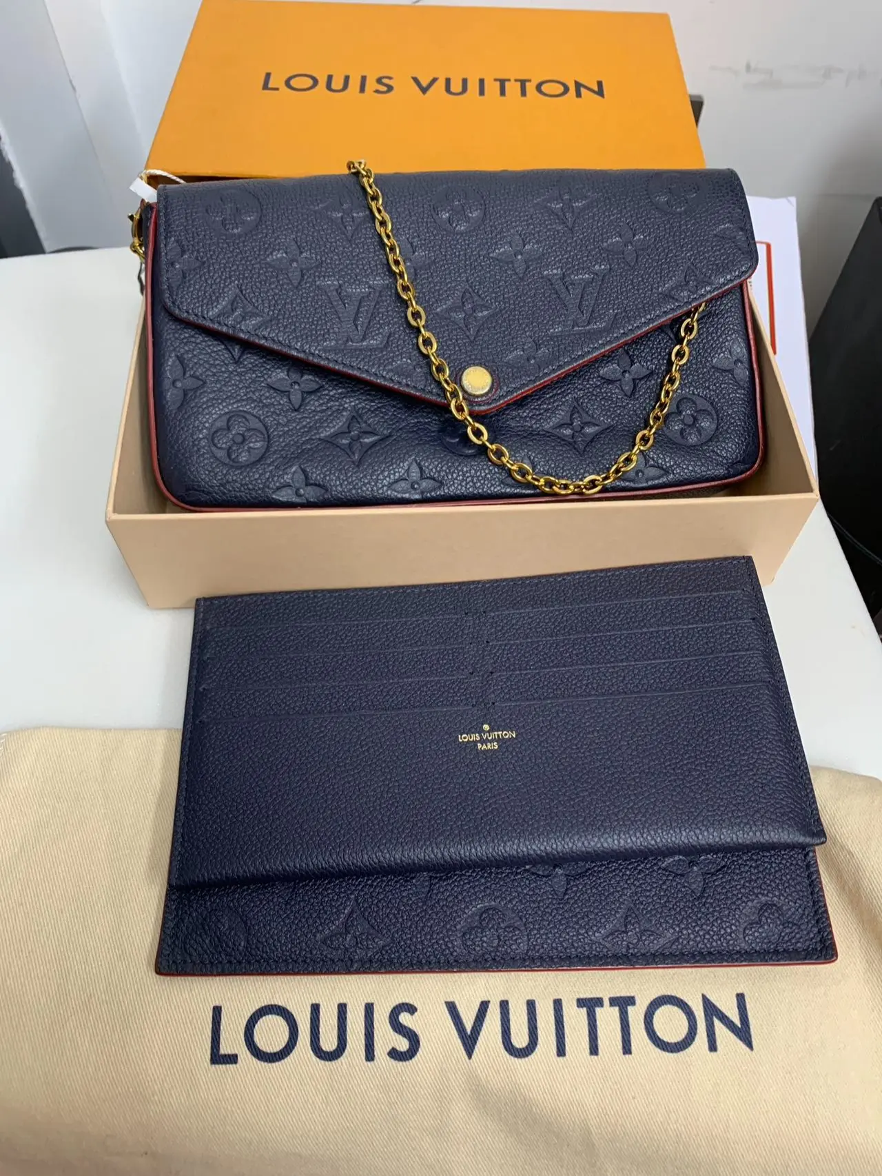 Pre-owned Louis Vuitton leather Clutches and wristlets Clutches & Wristlets Pochette Felicie Monogram Empreinte Navy/Marine Rouge XP01963