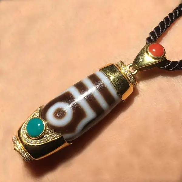 Traditional Two-Eyes Dzi Bead Pendant, Gold-Encased with Gemstone Accents, Suitable for Casual and Formal Occasions, Handcrafted Cultural Jewelry for Men and Women