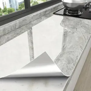 A roll [23.62 * 393.70 in ] of vinyl wall covering with glossy marble pattern for kitchen countertops. Oil and heat resistant, self-cutting and self-adhesive. Ideal for smooth surfaces such as furniture and appliances